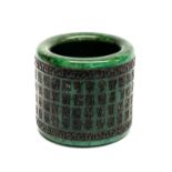 A Chinese engraved and inked jade/hardstone archers ring, W. 3cm, dia. 3.3cm.