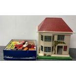 A 1960's wood and metal doll's house, size 36 x 25 x 40cm and contents.