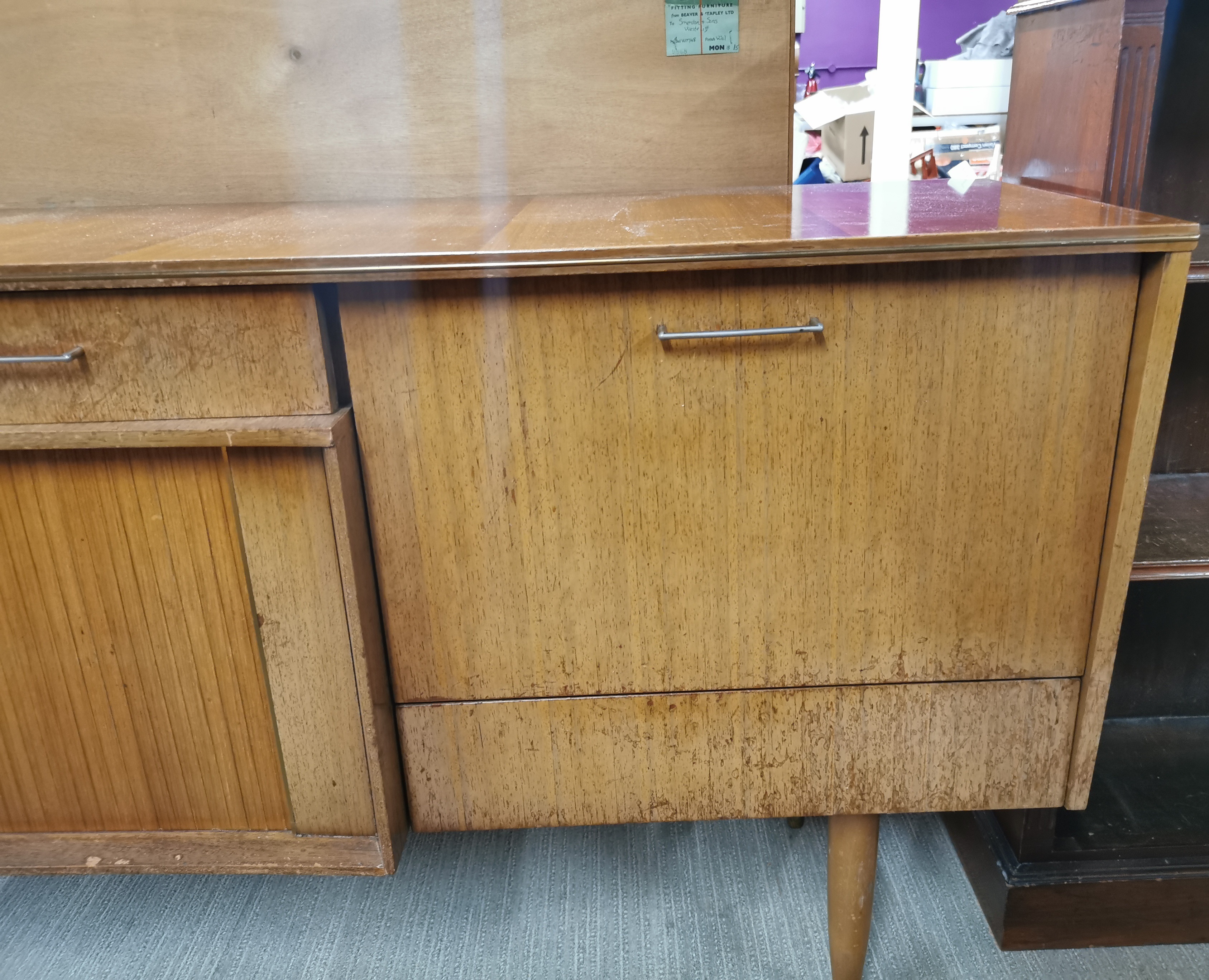 A 1970's teak sideboard with sliding door and a drop down cabinet with glass shelf, 145 x 79 x - Image 4 of 4