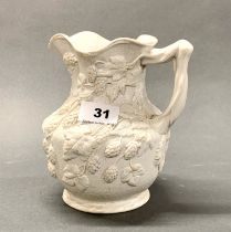 A mid 19th century Minton relief moulded wine jug, H. 18cm.
