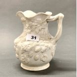 A mid 19th century Minton relief moulded wine jug, H. 18cm.