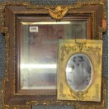 A 1920's framed bevelled glass mirror, frame size 48 x 48cm. Together with a further cherub mirror.