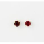 A pair of 9ct yellow gold ruby set stud earrings, L. 0.4cm.