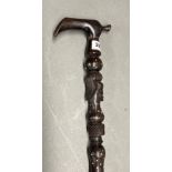 An African carved ebony tribal walking stick, L. 89cm.