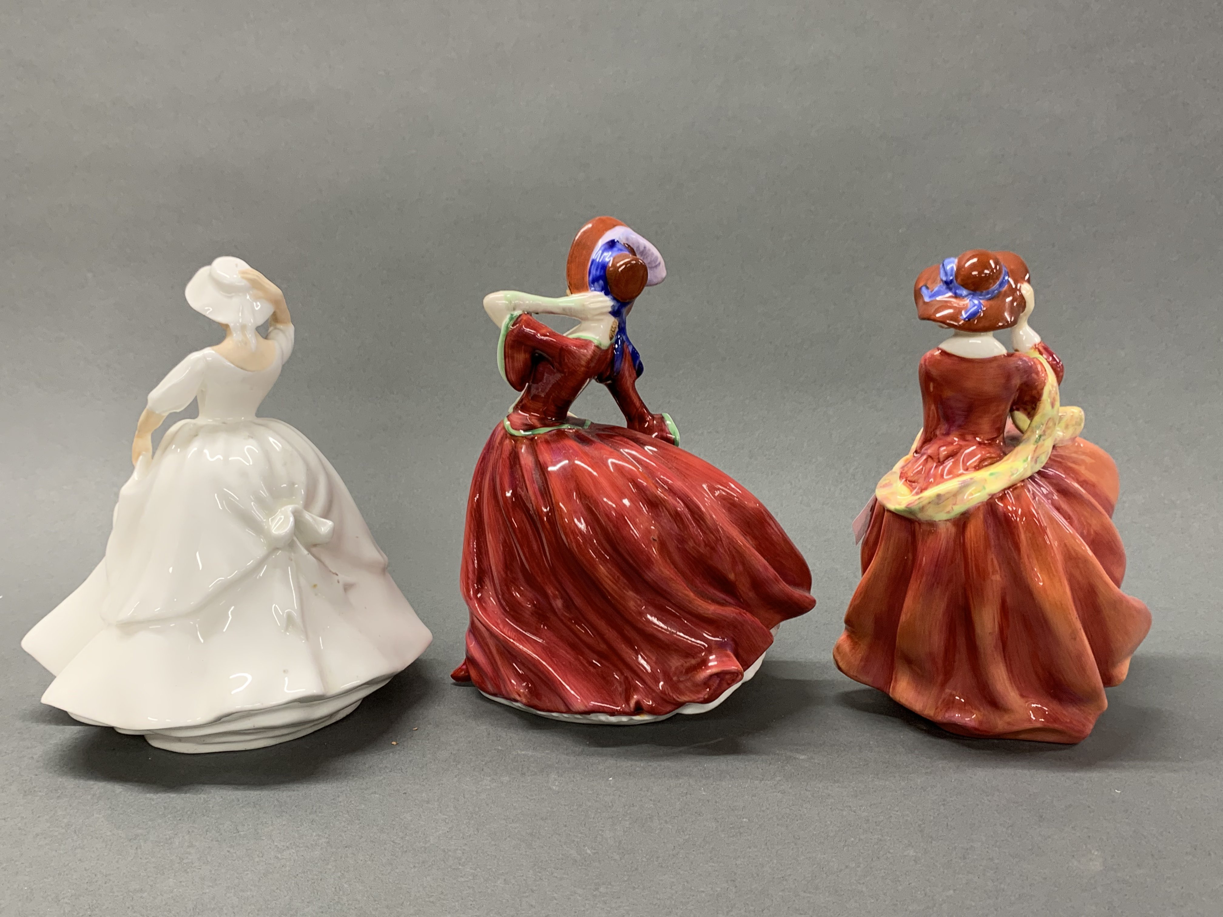 A group of three Royal Doulton porcelain figurines, 'Samantha, Top o' the hill' and 'Autumn - Image 2 of 2