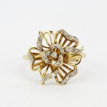 A 9ct yellow gold diamond set flower ring, (N.5).