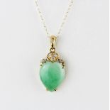 An 18ct yellow gold pendant set with cabochon jade and brilliant cut diamonds, L. 2.1cm, on a 9ct