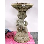 A vintage concrete cherub birdbath, H. 75cm.