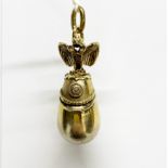 A Russian silver gilt egg and helmet pendant, worn 84 stamp and some wear to gilding, L. 5cm.