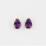 A pair of 9ct yellow gold stud earrings each set with a pear cut amethyst, L. 0.6cm.