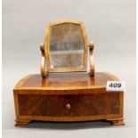 A 19th century mahogany and burr walnut miniature dressing table jewellery box with mirror, W. 24cm,