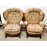 A pair of good quality spindle back conservatory armchairs with floral upholstery, H. 100cm.