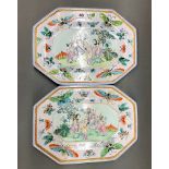 A pair of Chinese hand enamelled porcelain plates, decorated with court scenes and butterflies, W.