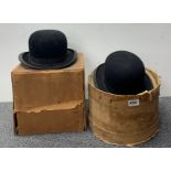 Two boxed gentleman's bowler hats.