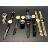 A quantity of vintage gents watches.