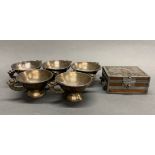 A group of five early 20th century Chinese silver plated heavy metal bowls with a dragon decorated