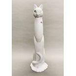 A large white Royal Haeger porcelain figure of a cat blinking with one glass eye, H. 51cm.