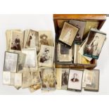 A Victorian workbox, containing a quantity of Victorian photographs and postcards.