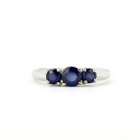 A hallmarked 9ct white gold ring set with round cut sapphires, (O.5).