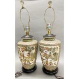 A pair of Chinese hand enamelled porcelain lamp bases, H. with shade frame 67cm.