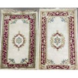 A heavy cream ground wool rug, 190 x 98cm, together with a similar style wool rug, 176 x 92cm.