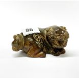 A Chinese carved jade/hardstone figure of a mythical animal with lotus shaped tail, L. 12.5cm, H.