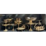A quantity of silver plated comports and cake stands.
