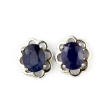 A pair of 925 silver earrings each set with an oval cut sapphire, L. 1.5cm.
