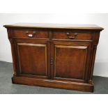 An Ian Dickson mahogany sideboard with burr walnut trim, 117 x 84 x 44cm.