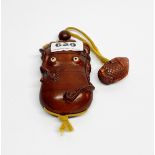 A carved fruitwood Inro in the shape of a squid, L. 10cm with glass eyes and fish shaped Netsuke, L.