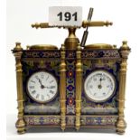 An enamelled bronze double clock barometer, W. 13cm, H. 14cm.