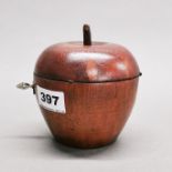 A wooden apple tea caddy, H. 12cm, Dia. 11cm.