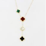An 18ct yellow gold (stamped 750) clover necklace set with malachite, carnelian, mother of pearl and