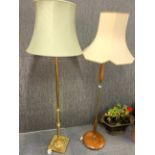 1970's teak and brass standard lamp, together with a further gilt brass standard lamp.