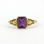 A 9ct yellow gold ring set with emerald cut amethyst, (T.5).