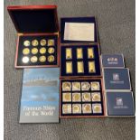 A case of twelve limited edition cupro nickel and gold plated inset British coins, together with