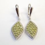 A pair of 925 silver drop earrings set with round cut peridots and white stones, L. 3.5cm.