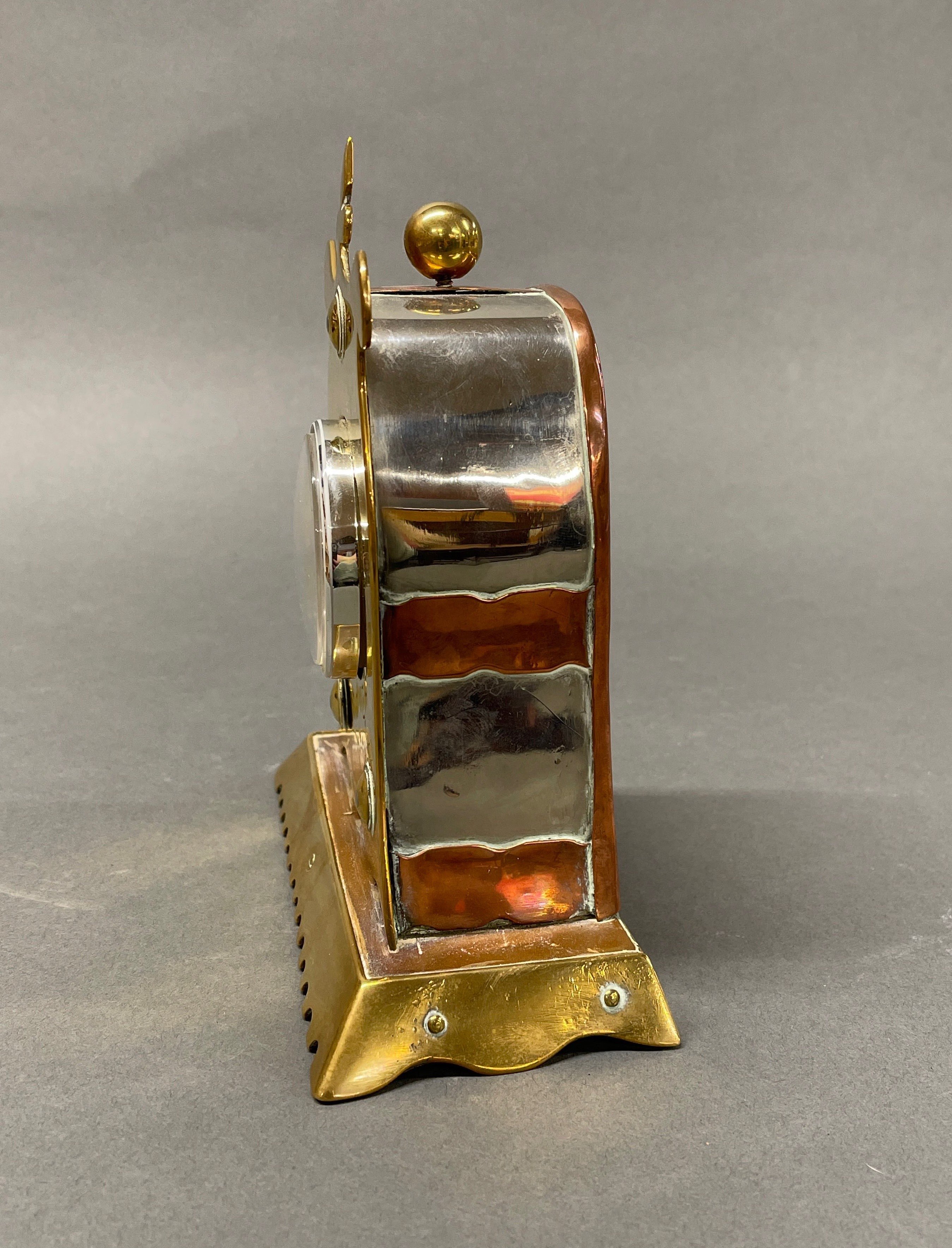 An Arts and Crafts copper and brass mantel clock, with replacement battery movement, H. 19cm. - Image 2 of 3