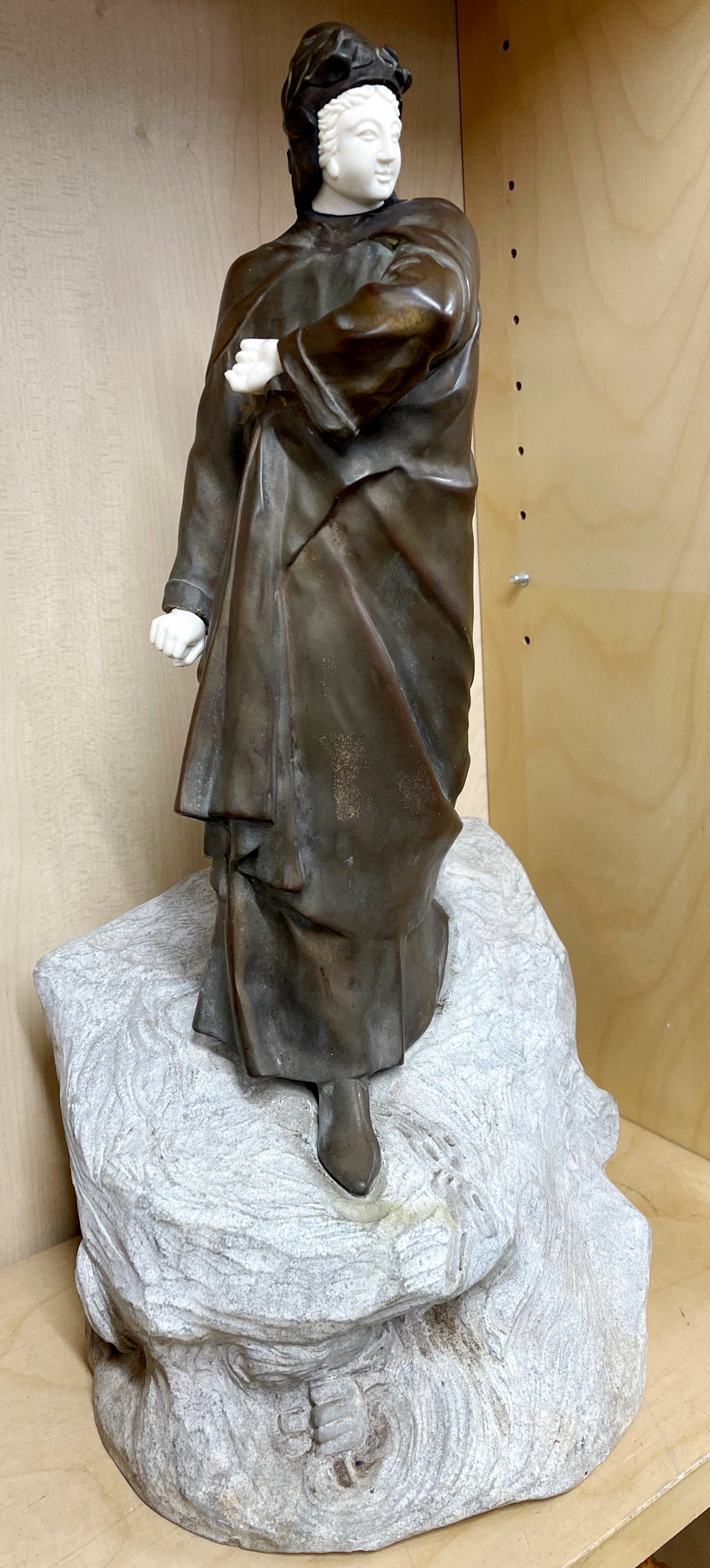 A superb early 20th century bronze figure of a woman with a coat, mounted on a carved stone base - Image 4 of 4