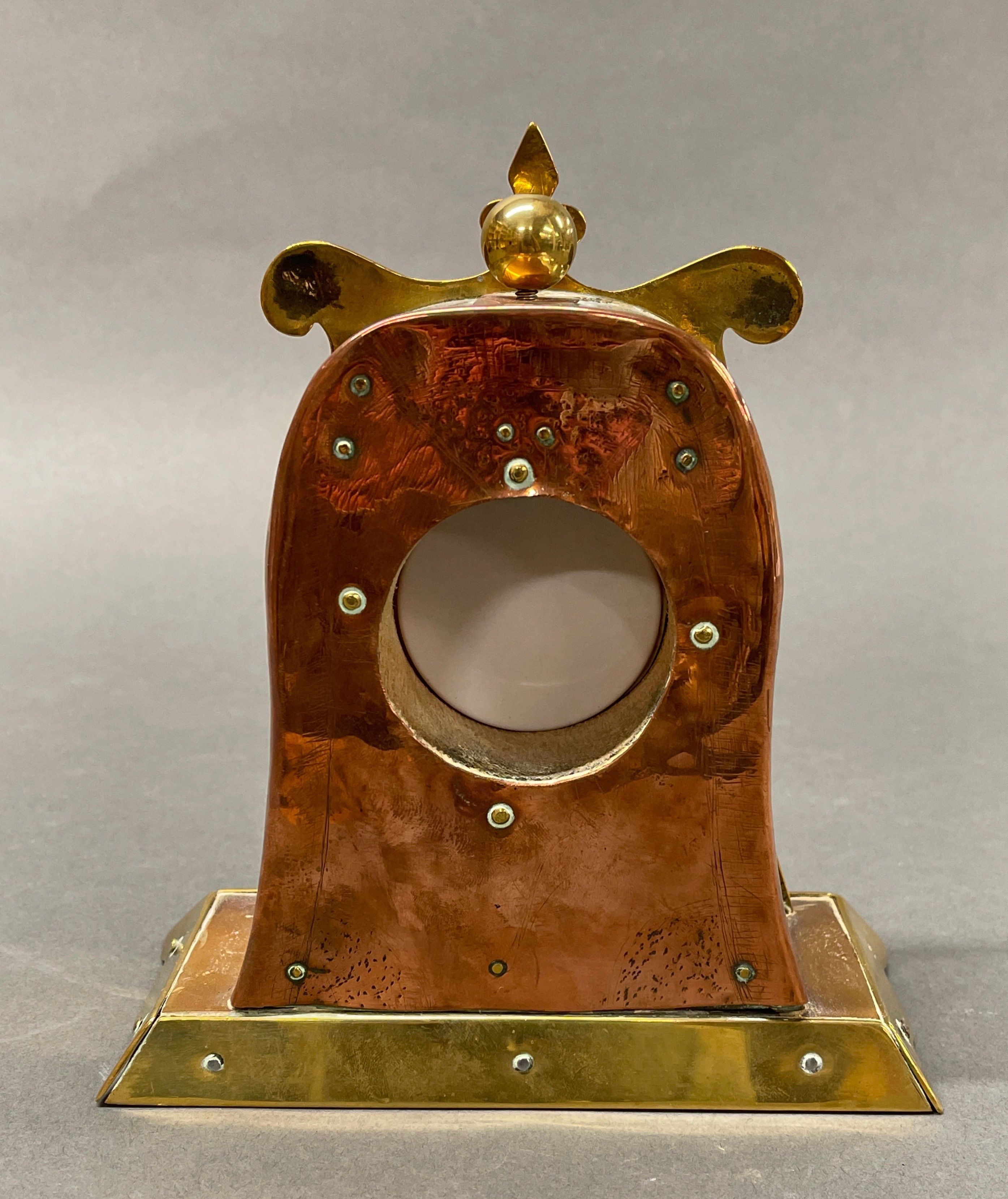 An Arts and Crafts copper and brass mantel clock, with replacement battery movement, H. 19cm. - Image 3 of 3