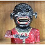 An original aluminium black boy money box.