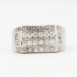 A heavy gentleman's white metal (tested 18ct gold) ring set with brilliant cut diamonds, approx. 2.