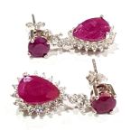 A pair of 925 silver drop earrings set with pear cut rubies and white stones, L. 2cm.