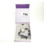 A silver, mother of pearl and amethyst ladies wristwatch.