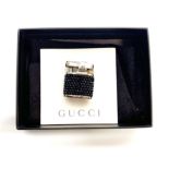 A Gucci ladies black stone encrusted lighter, H. 3.5cm.