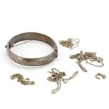 A hallmarked silver bangle together with four silver chains, all A/F.