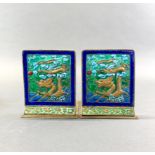 A pair of mid 20th century Chinese enamelled bookends, H. 13cm.