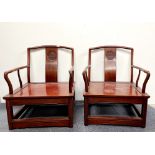A pair of Chinese carved low hardwood chairs, H. 80cm.