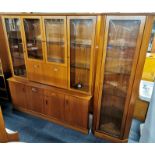A vintage G Plan teak display cabinet with drop-down mirror backed middle compartment together