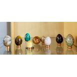 A collection of polished stone eggs, largest H. 7cm.